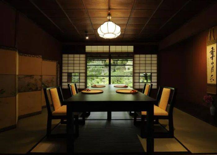 The private dining room of Kanazawa Gyokusentei, looking out over a traditional Japanese garden.